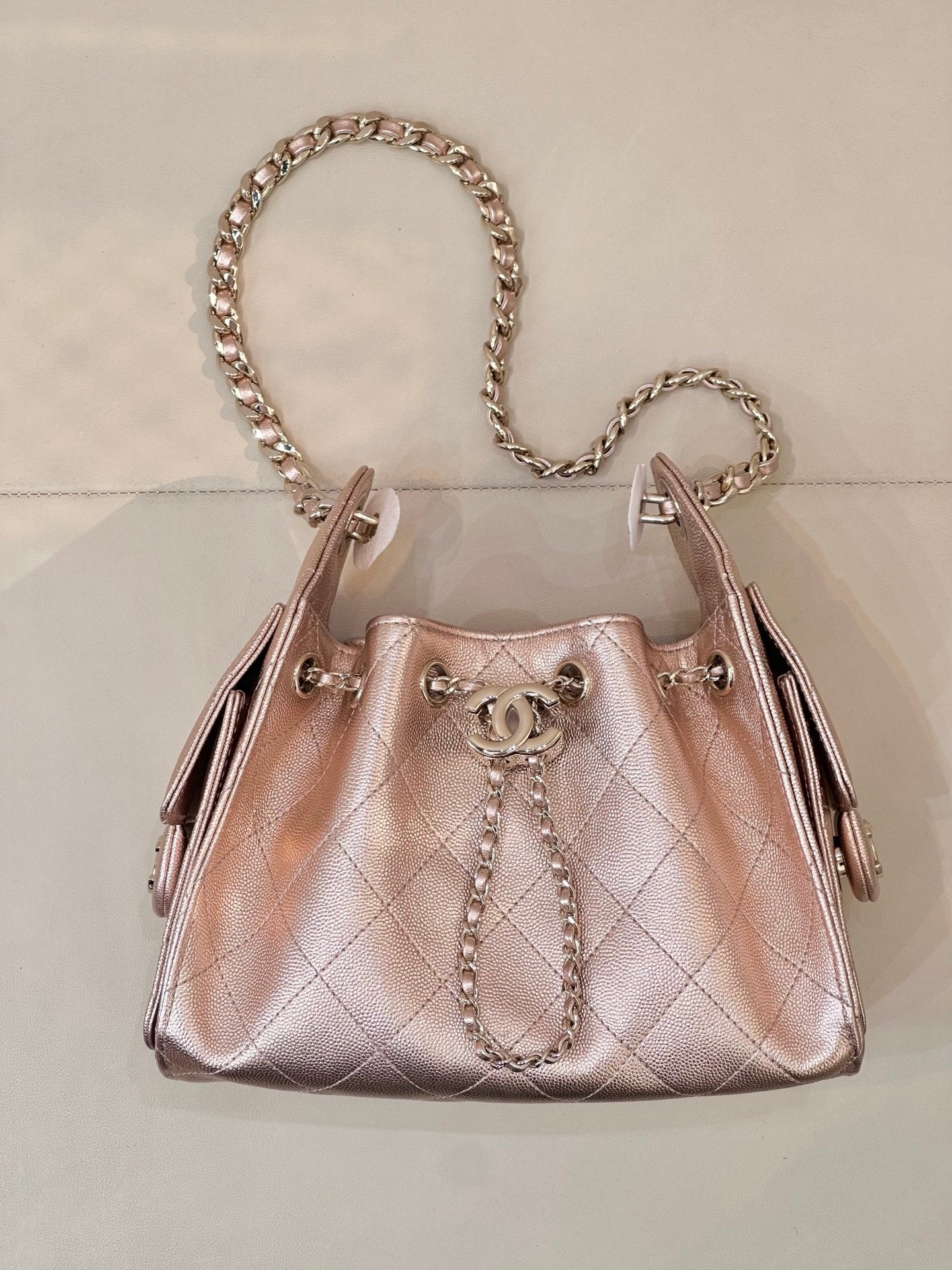 Chanel quilted top-handle handbag with chain strap, rose-pink leather, logo medallion