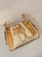 Chanel quilted gold handbag with chain shoulder strap and curved top handles
