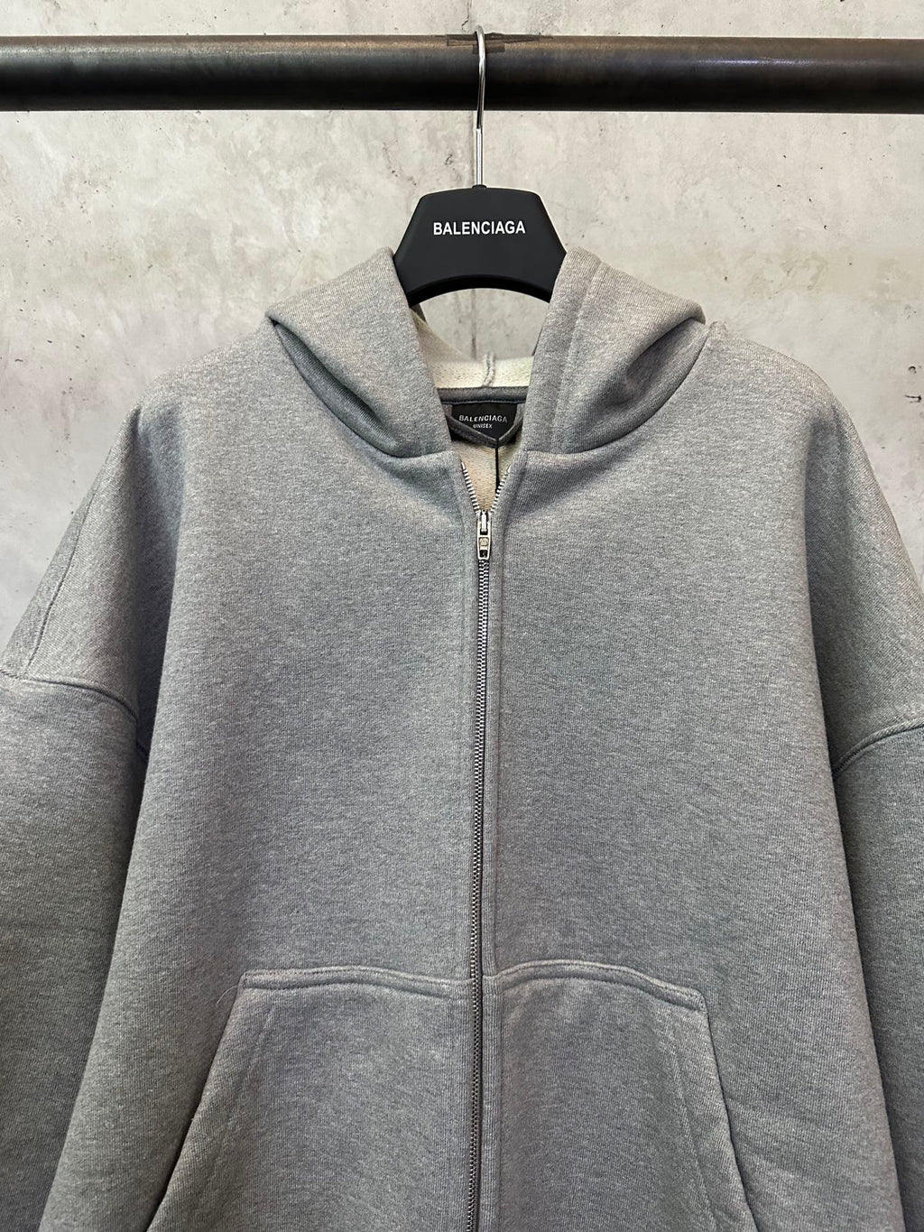 Balenciaga grey zip-up hoodie with hood, front zipper, and kangaroo pocket