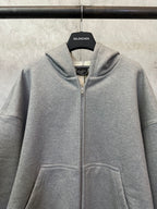 Balenciaga grey zip-up hoodie with hood, front zipper, and kangaroo pocket