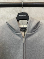 Balenciaga grey zip-up hoodie close-up at hood, collar, and zipper