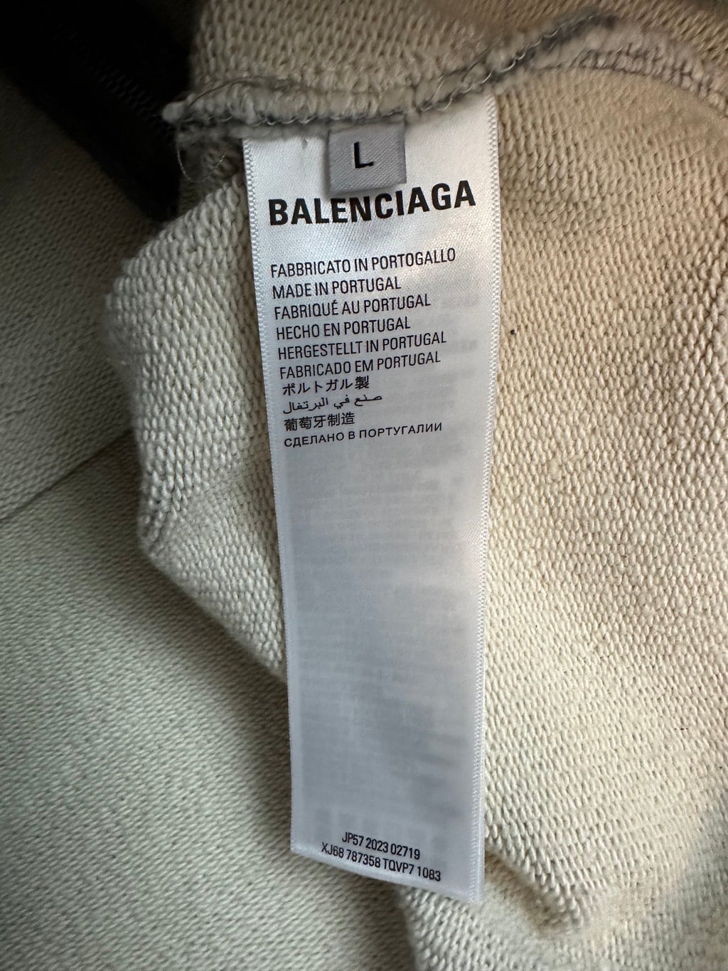 Balenciaga size L fabric label on grey hoodie neck interior