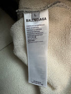Balenciaga size L fabric label on grey hoodie neck interior