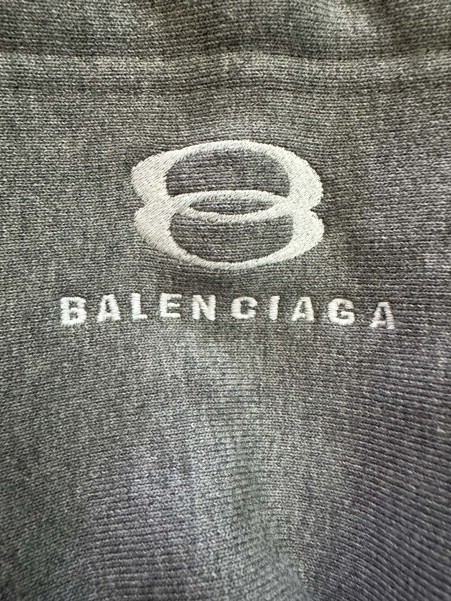 Balenciaga logo graphic on grey knit hoodie fabric