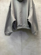 Balenciaga gray pullover hoodie with hood, kangaroo pocket, and ribbed cuffs and hem.