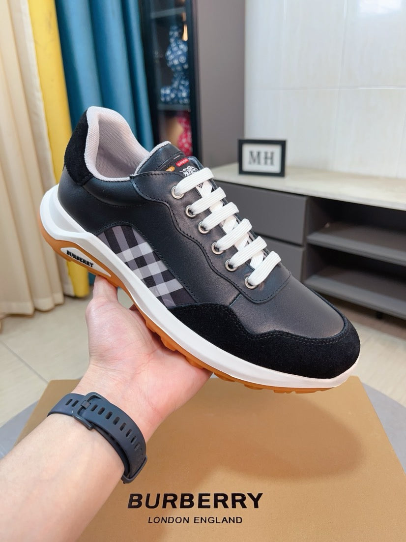 Burberry sneakers in dark navy/black with check strap detail and orange rubber sole