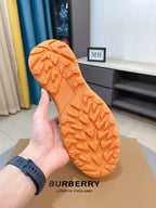 Burberry sneaker outsole with orange tread pattern and durable rubber grip