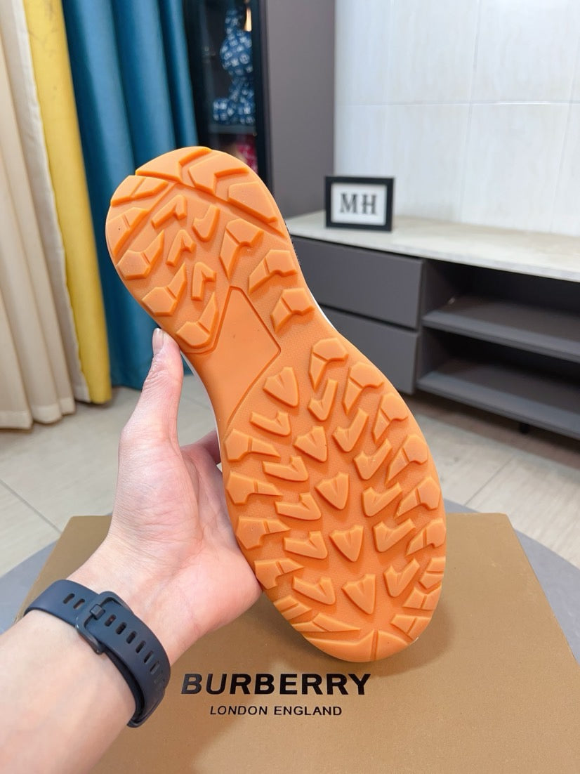 Burberry sneaker outsole with orange tread pattern and durable rubber grip