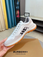 Burberry white leather low-top sneakers with check panel and orange-trim outsole
