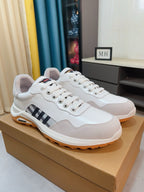 Burberry white leather sneakers with lace-up front, check side stripe, orange sole