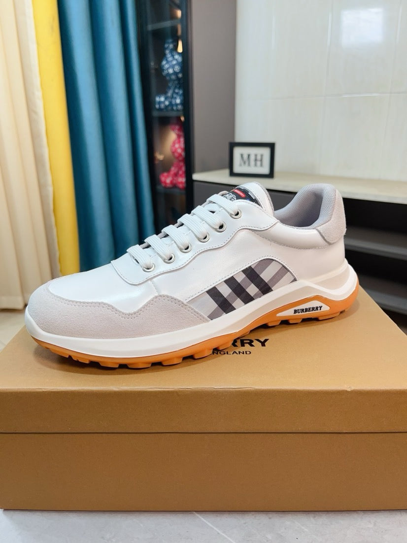 Burberry white leather sneakers with check strap detail and orange rubber outsole