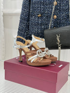 Gucci heeled sandals with silver straps and jeweled G buckle, tan block heel