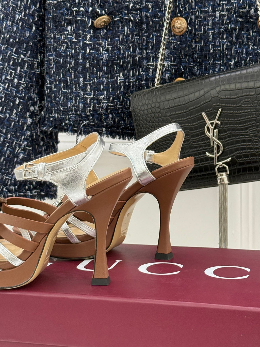 Gucci heeled sandal side view, metallic silver straps, jeweled buckle, tan heel