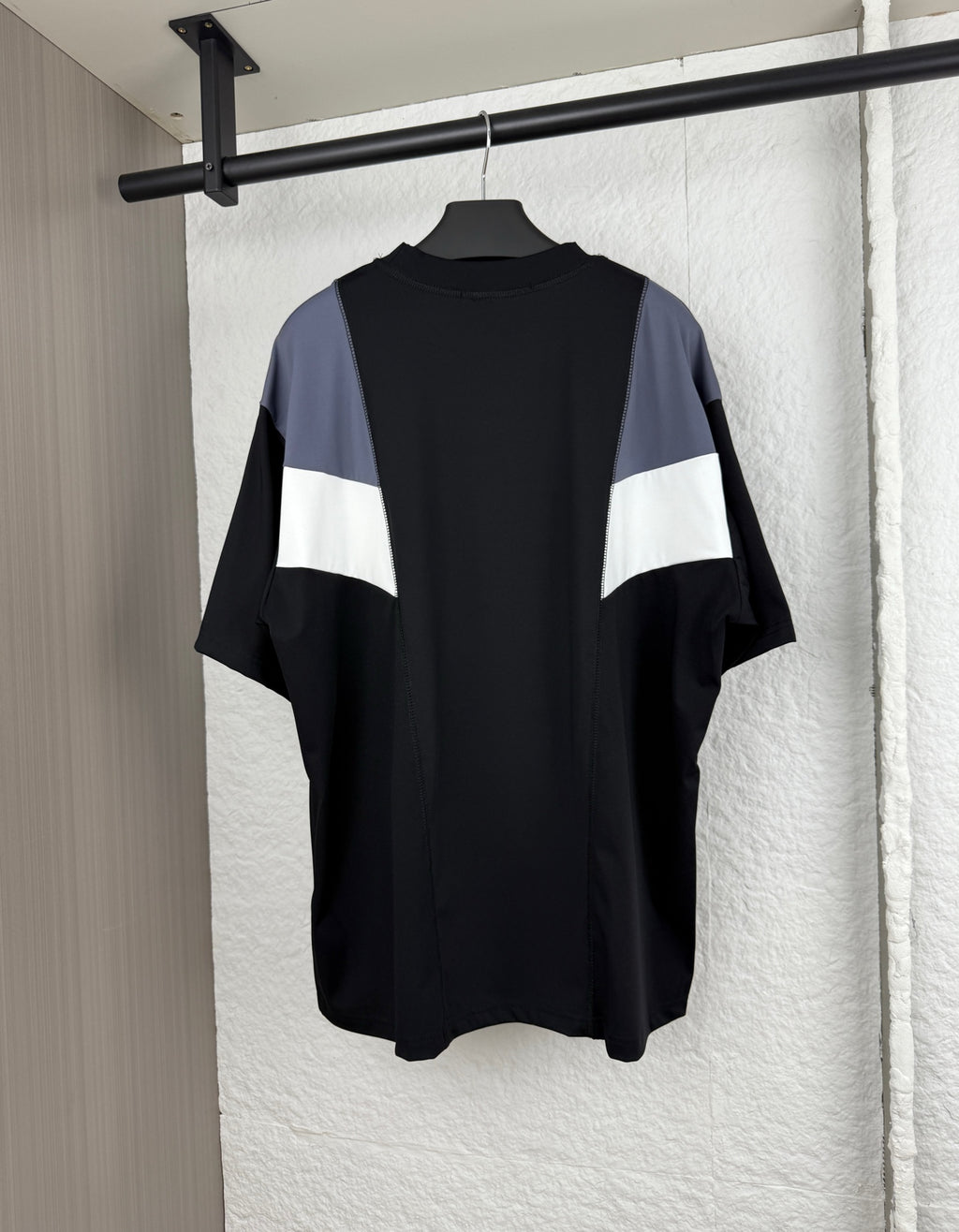 Louis Vuitton short-sleeve T-shirt, back view with black body and blue/white chevron panel