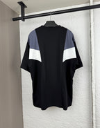 Louis Vuitton short-sleeve T-shirt, back view with black body and blue/white chevron panel