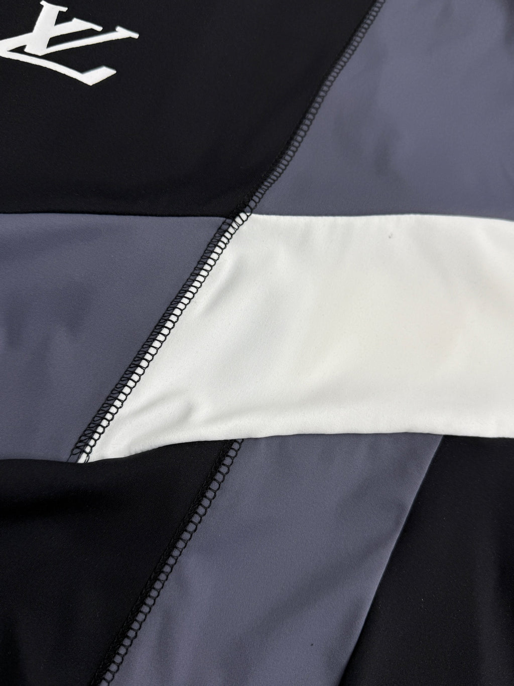 Louis Vuitton short-sleeve T-shirt side panel with stitched trim and blue/white color blocks
