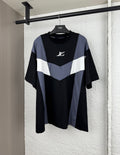 Louis Vuitton short-sleeve T-shirt with black body and blue/white chevron panel, logo on chest