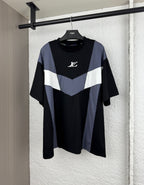 Louis Vuitton short-sleeve T-shirt with black body and blue/white chevron panel, logo on chest