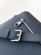 Blue Louis Vuitton bag with metal turn-lock hardware and zipper