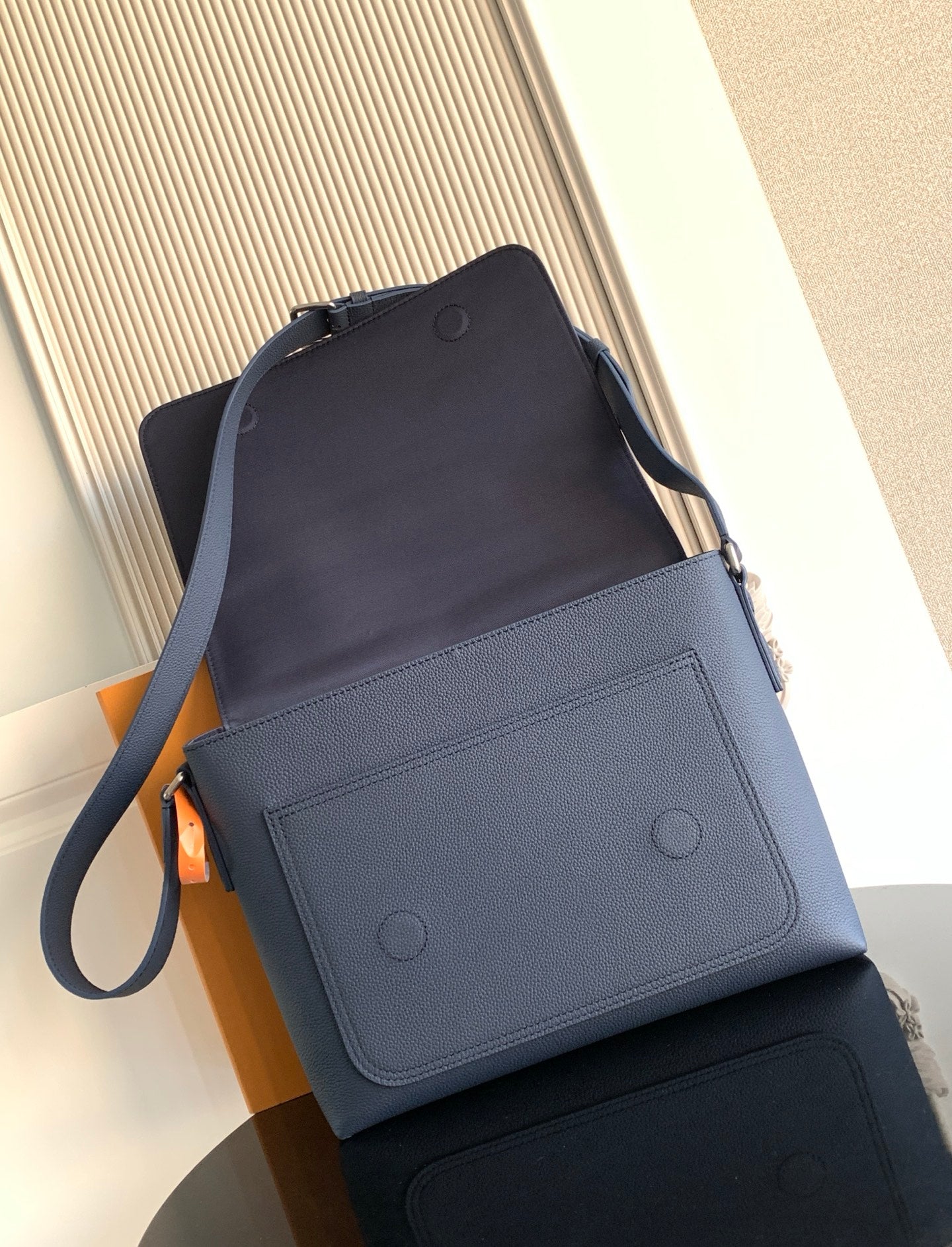 Louis Vuitton crossbody bag in navy leather with front patch pockets and strap