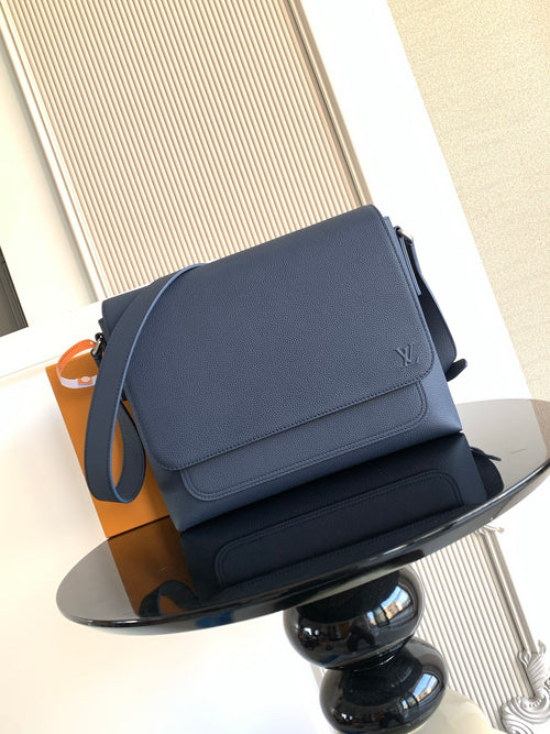 Louis Vuitton crossbody bag in navy textured leather, front flap with logo