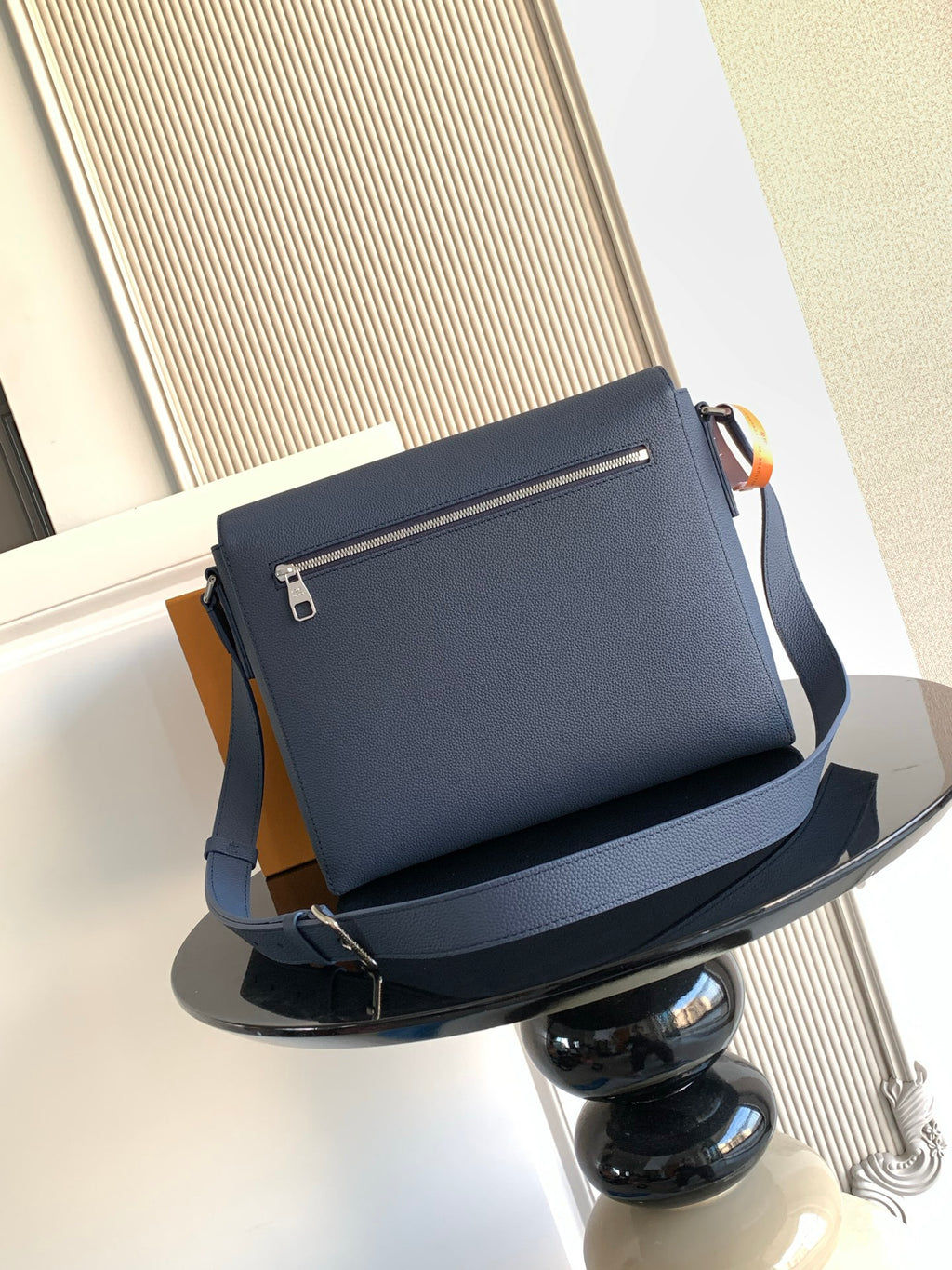 Blue Louis Vuitton crossbody bag with front flap and zipper