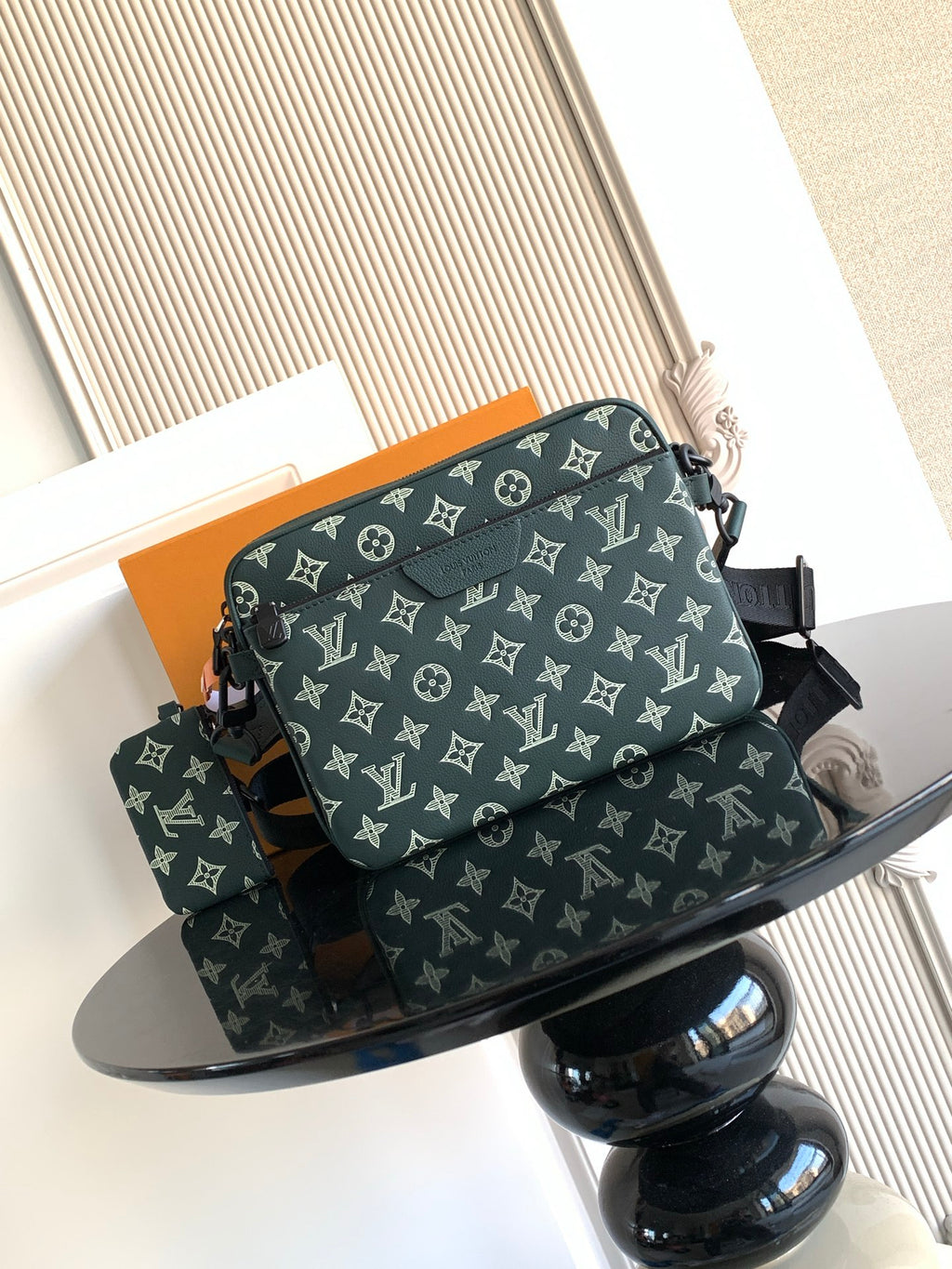 Louis Vuitton men's monogram shoulder bag in dark green, with strap and top handle