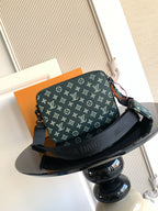 Louis Vuitton men's monogram shoulder bag in dark green, front view with adjustable strap