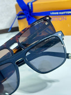 Louis Vuitton sunglasses, blue frame with gold star and LV logo on temples