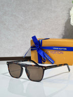 Louis Vuitton sunglasses, dark lenses, black frame with star motif and patterned temples