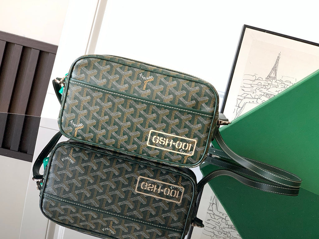 Green Goyard crossbody bag set with two compartments, zipper closures, and shoulder strap