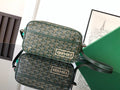 Green Goyard crossbody bag set with two compartments, zipper closures, and shoulder strap