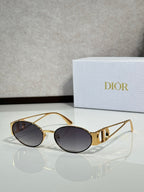 Gold-framed round sunglasses with dark tinted lenses