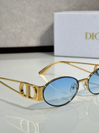 Gold round sunglasses with blue tinted lens and logo temple