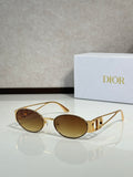 Gold-framed round sunglasses with amber tinted lenses