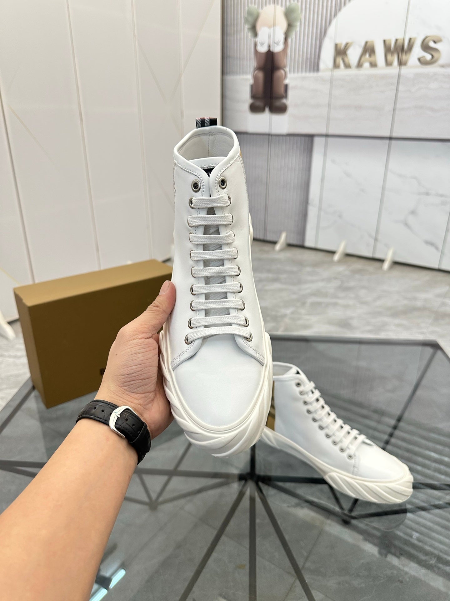 Burberry white high-top sneakers front view with lace-up and padded collar