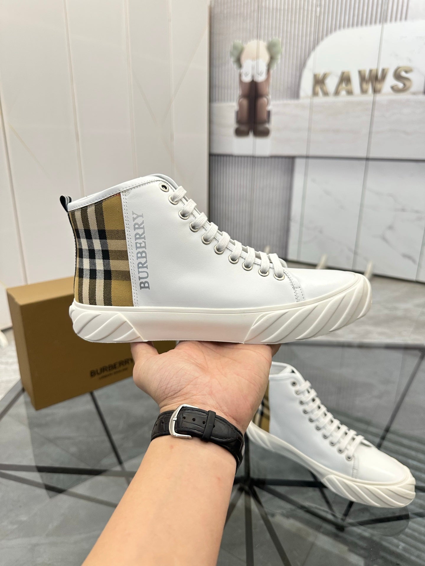 Burberry white high-top sneakers with plaid side stripe and lace-up design
