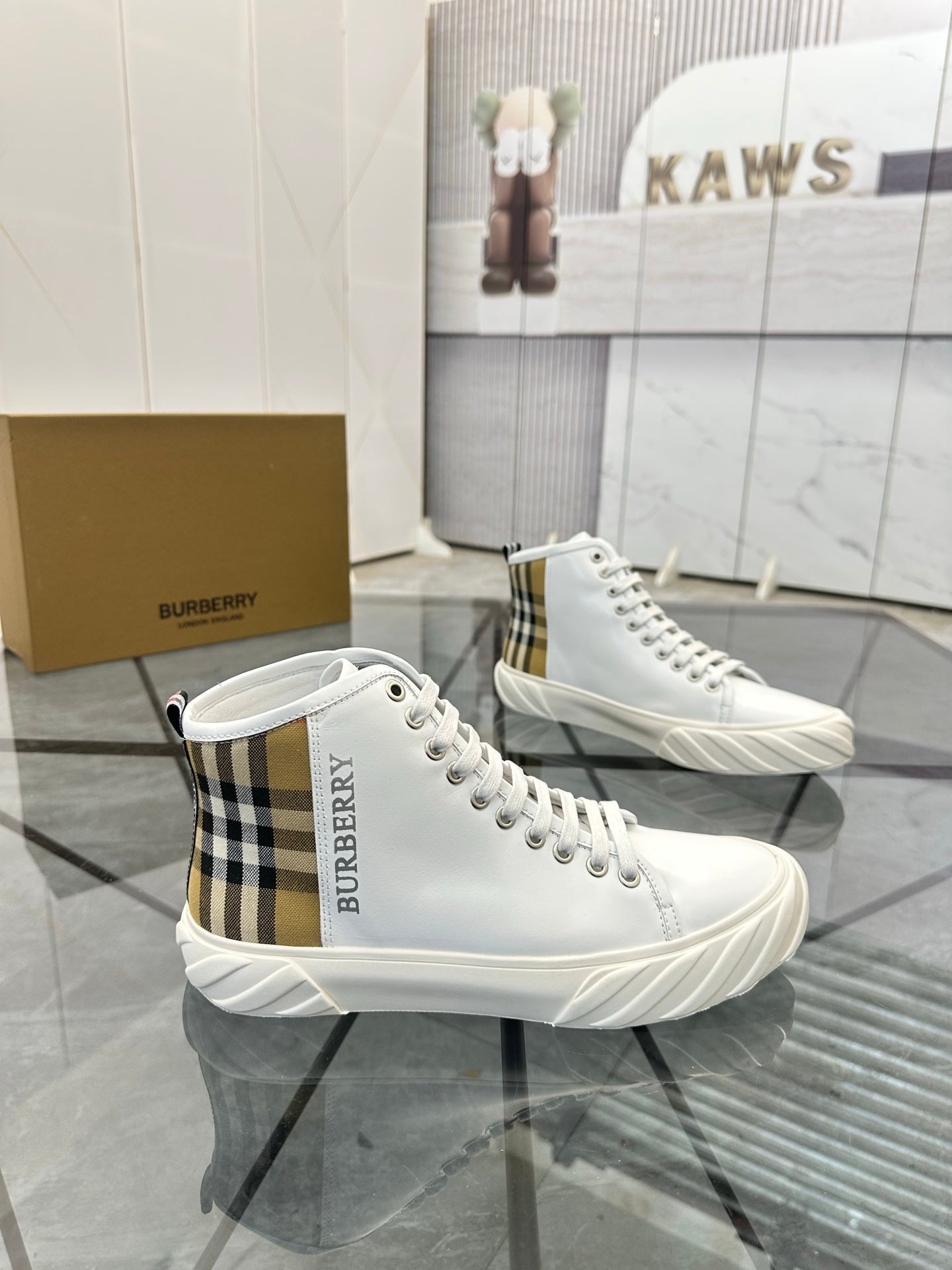 Burberry white high-top sneakers with plaid ankle detail and lace-up laces