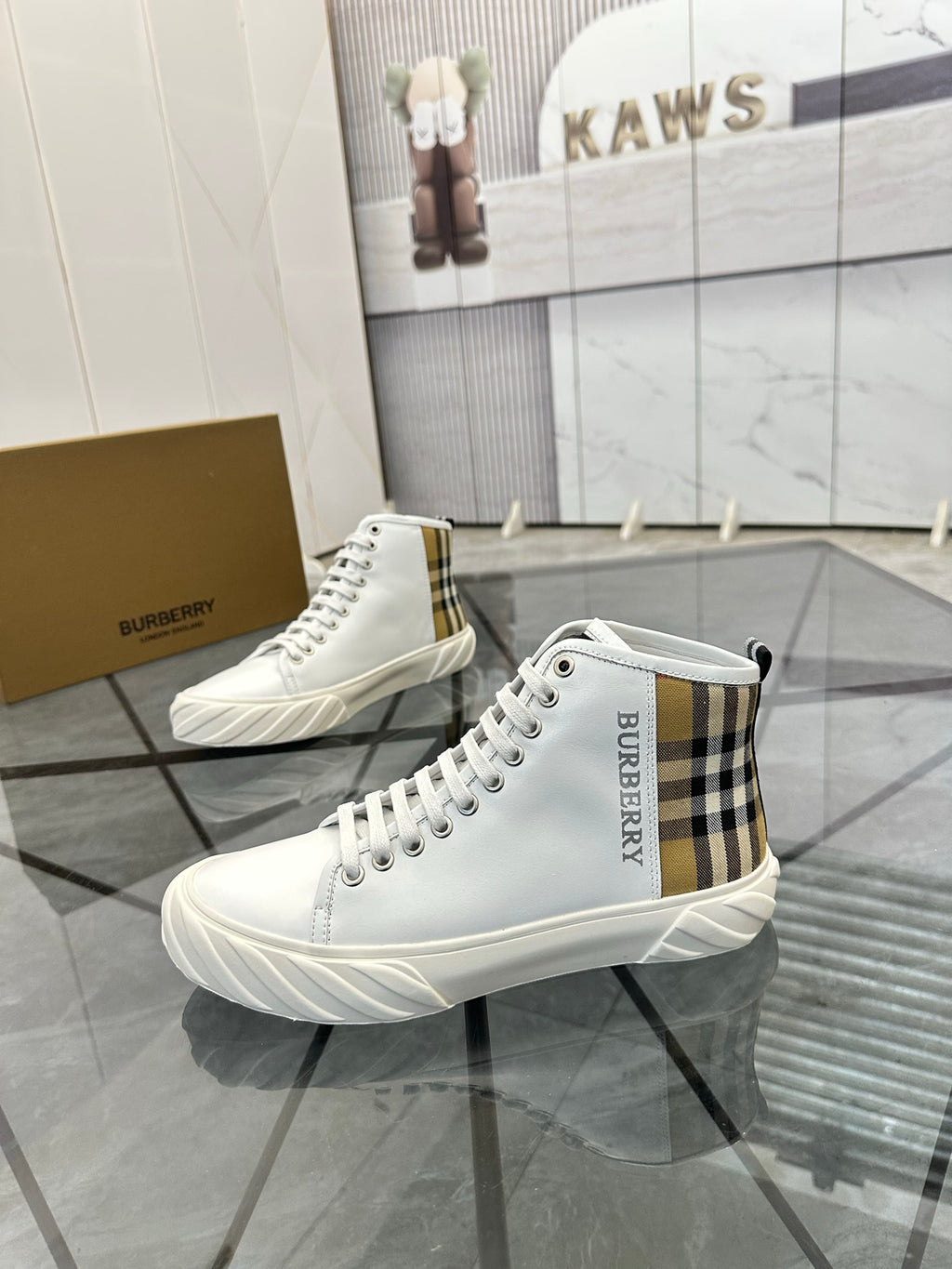 Burberry white high-top sneakers with plaid side panels and lace-up closure