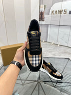 Burberry black lace-up sneakers with tartan panel at tongue and white contrast sole