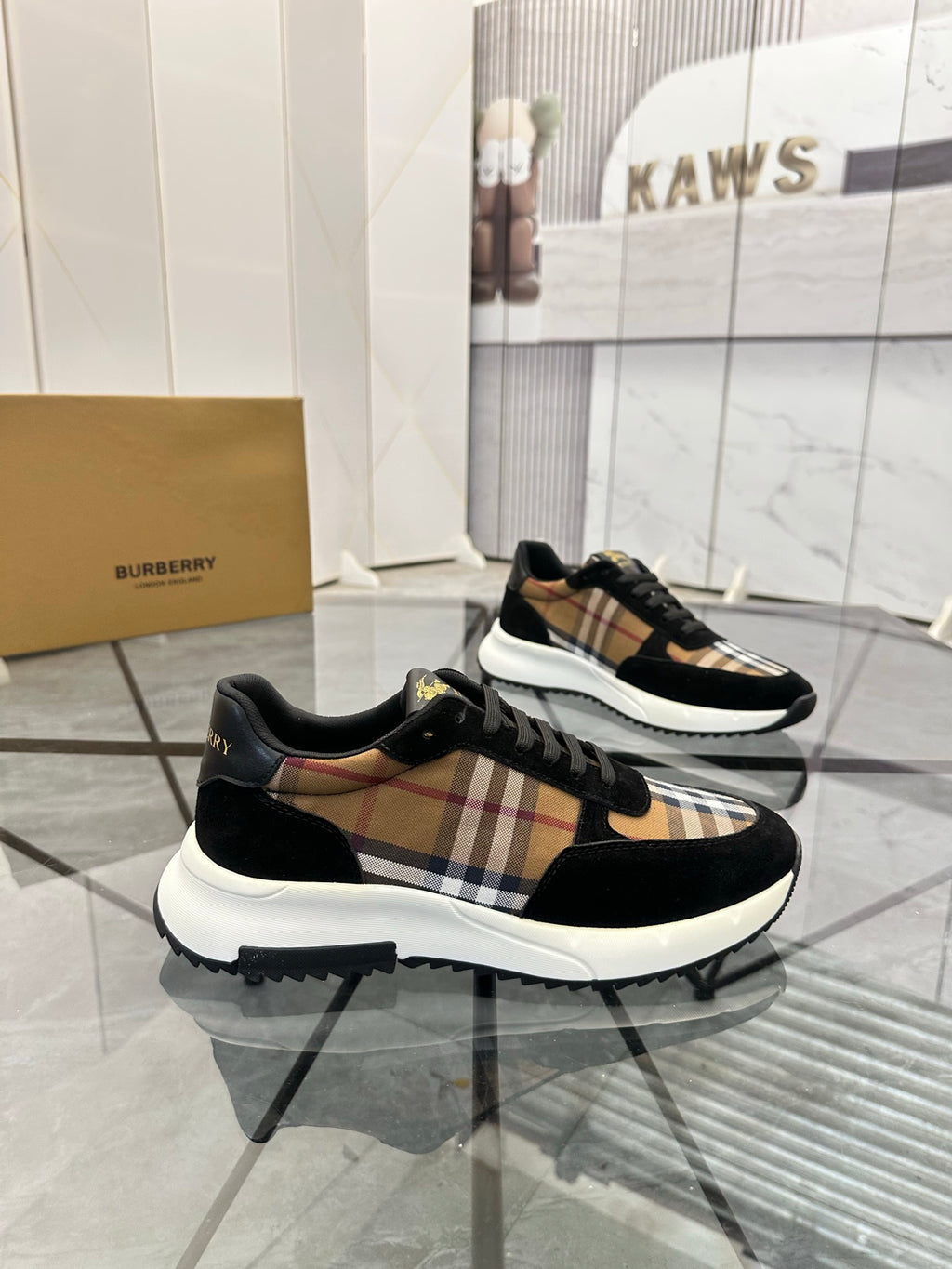 Burberry low-top sneakers with black upper and tartan check stripe, white sole