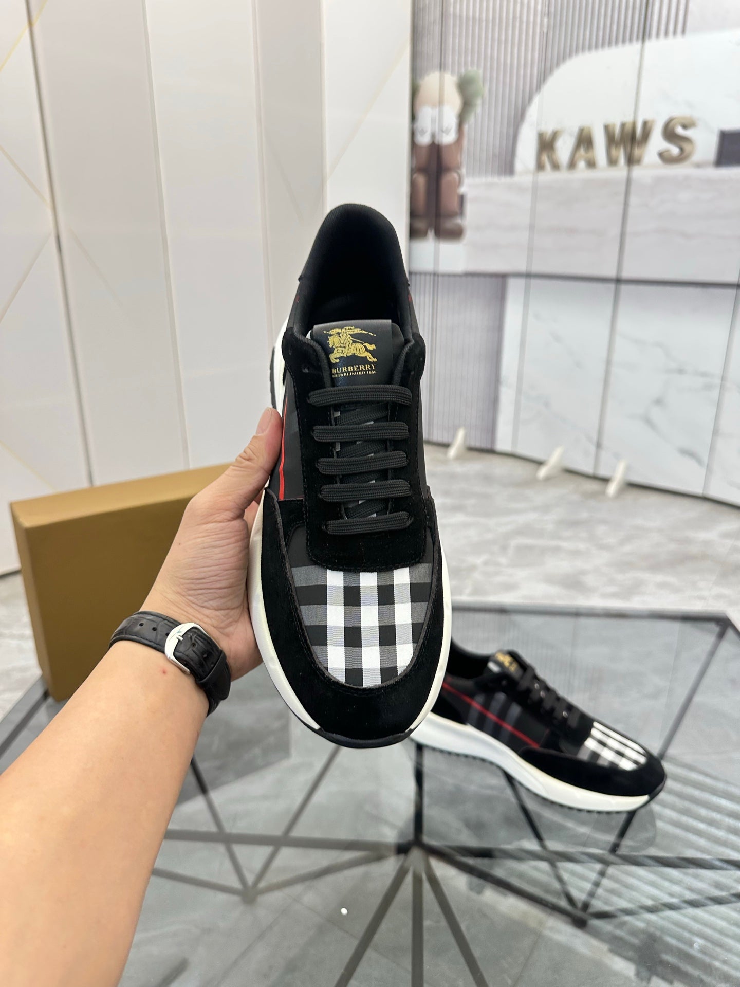 Burberry black low-top sneakers with check-pattern panel and black laces, white sole