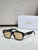 Dior sunglasses with black frames and amber lenses, gold logo on temple