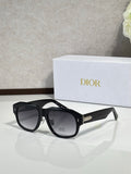 Dior sunglasses with black cat-eye frames and dark lenses, gold logo on temple
