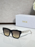 Dior sunglasses with black square frames and gray-tinted lenses, logo plate on front side