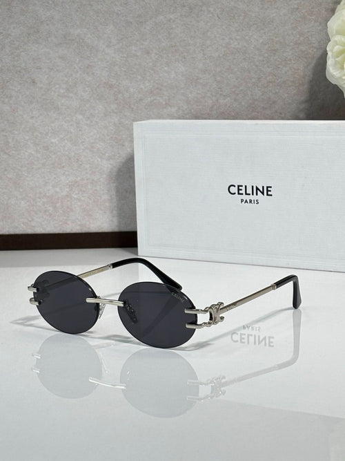 Celine sunglasses with dark gray round lenses and metal frames, gold-tone accents