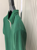 Prada polo shirt side view, dark green short sleeve and shoulder seam