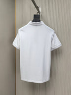 White polo shirt on hanger, back view with ribbed collar