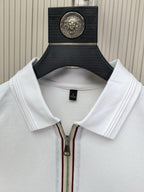 White Prada polo shirt on hanger, showing half-zip front and ribbed collar