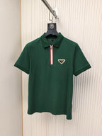 Green short-sleeve polo shirt with half-zip and logo patch